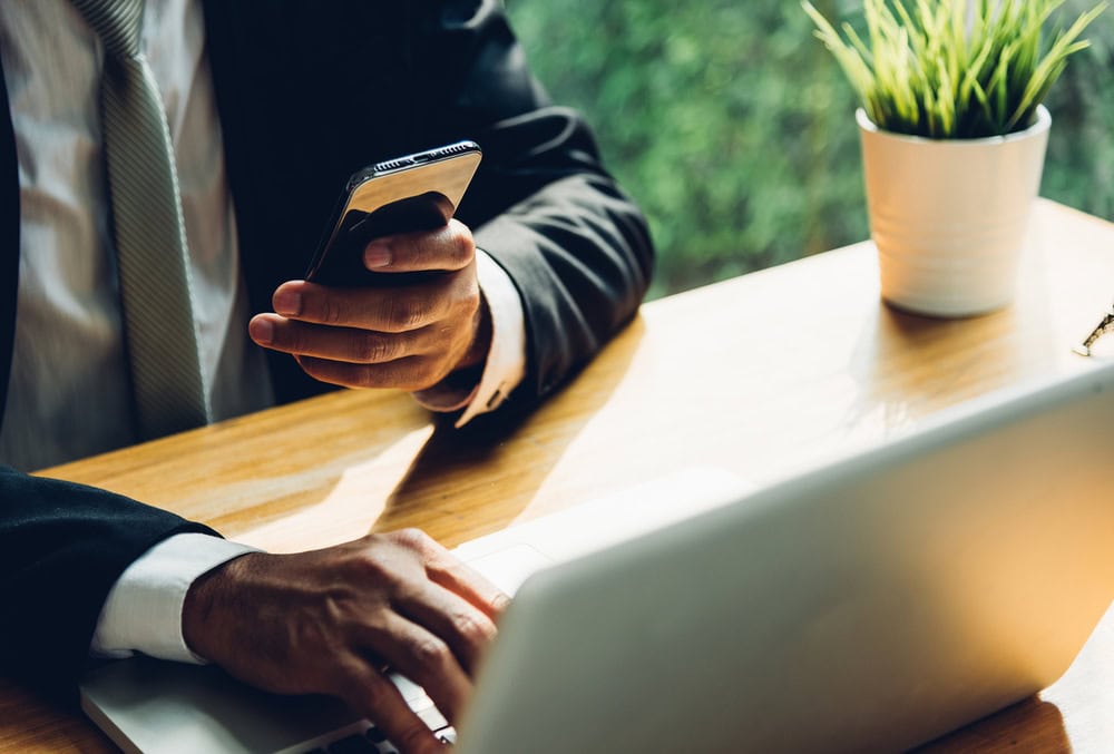 bigstock-Business-Man-Working-On-Mobile-347011276