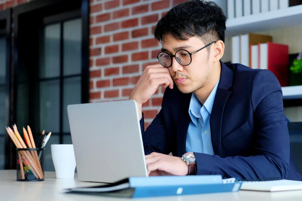 bigstock-Young-Asian-Office-Man-Struggl-323764129