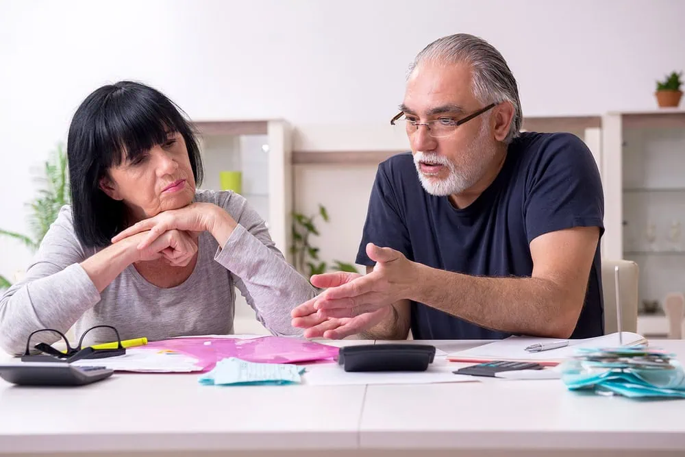 bigstock-Senior-couple-discussing-finan-357339506