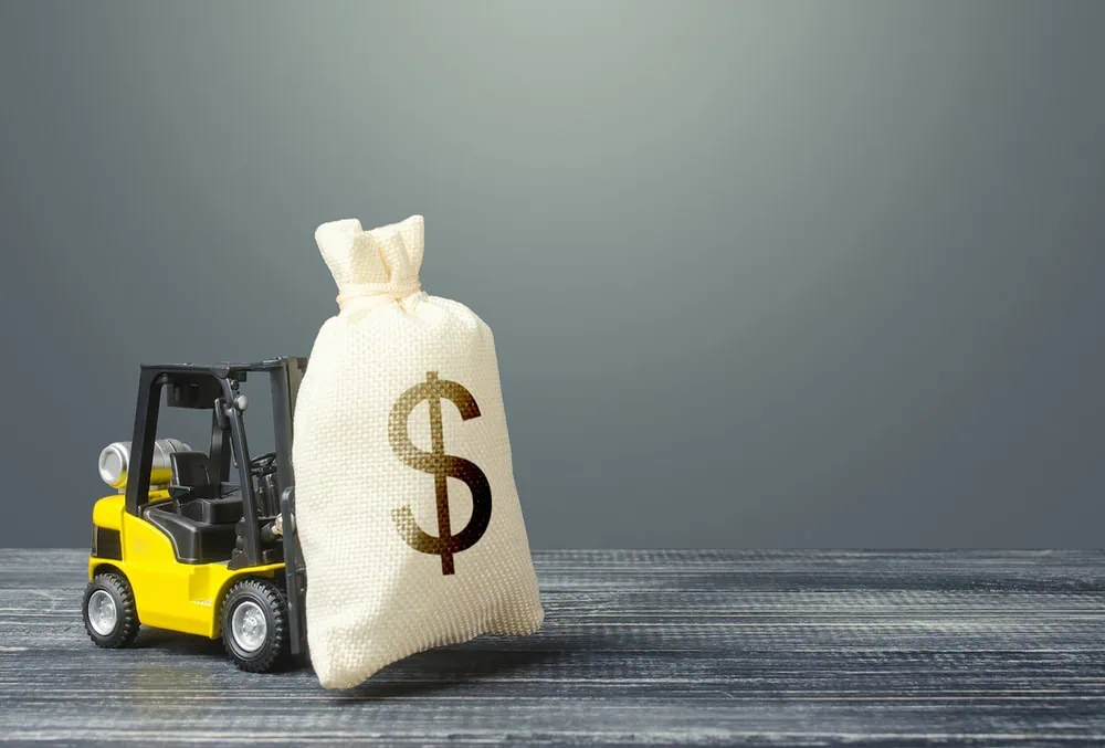 bigstock-Yellow-Forklift-Carries-A-Doll-350432437