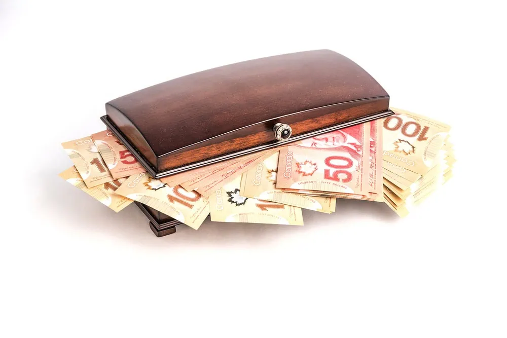 bigstock-Canadian-Money-Bills-On-White--384802343